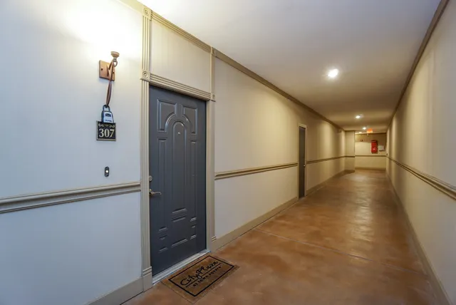 a view of entryway with wooden floor