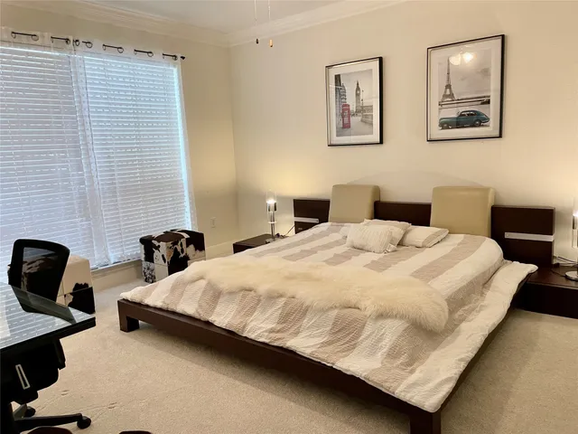 a bedroom with a bed and chair