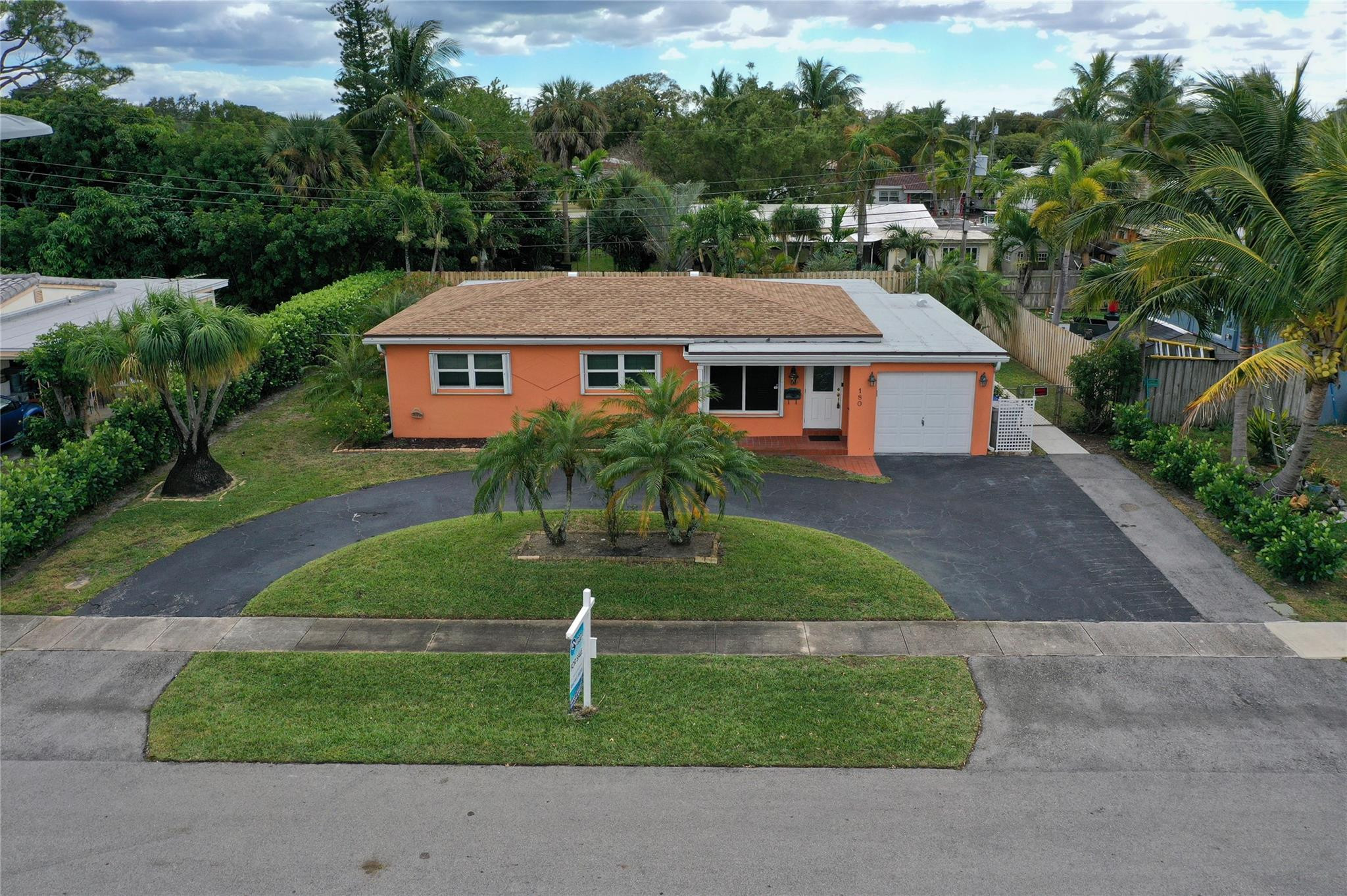 180 Southwest 9th Court Pompano Beach, FL 33060 - Photo 21 of 27 a aerial view of a house next to a yard and trees