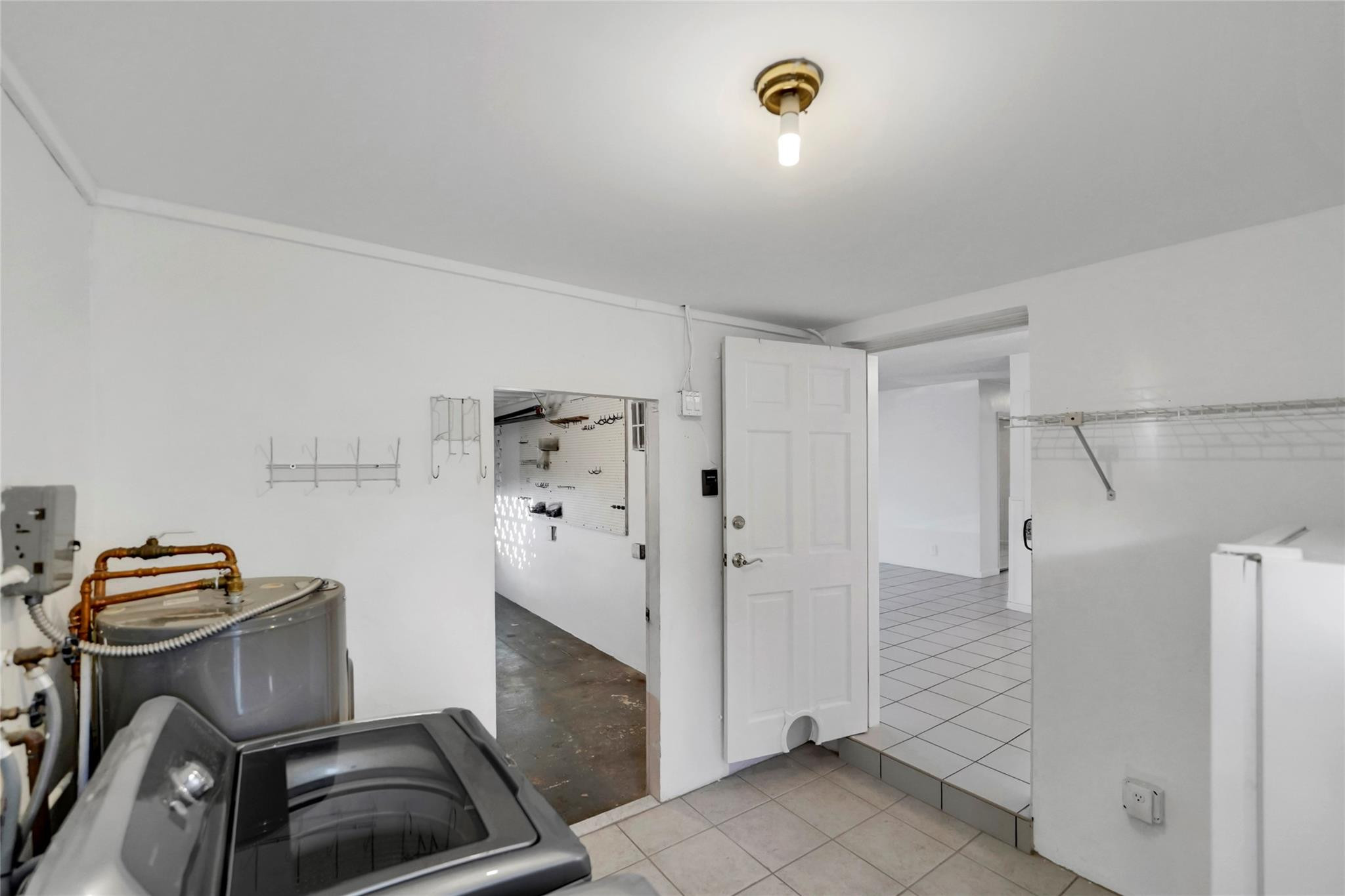 180 Southwest 9th Court Pompano Beach, FL 33060 - Photo 25 of 27 a view of a storage & utility room with a stove