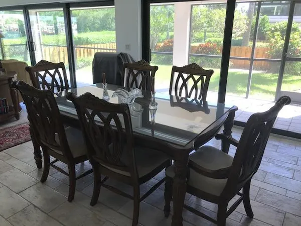 a view of a dining room with furniture window and outside view