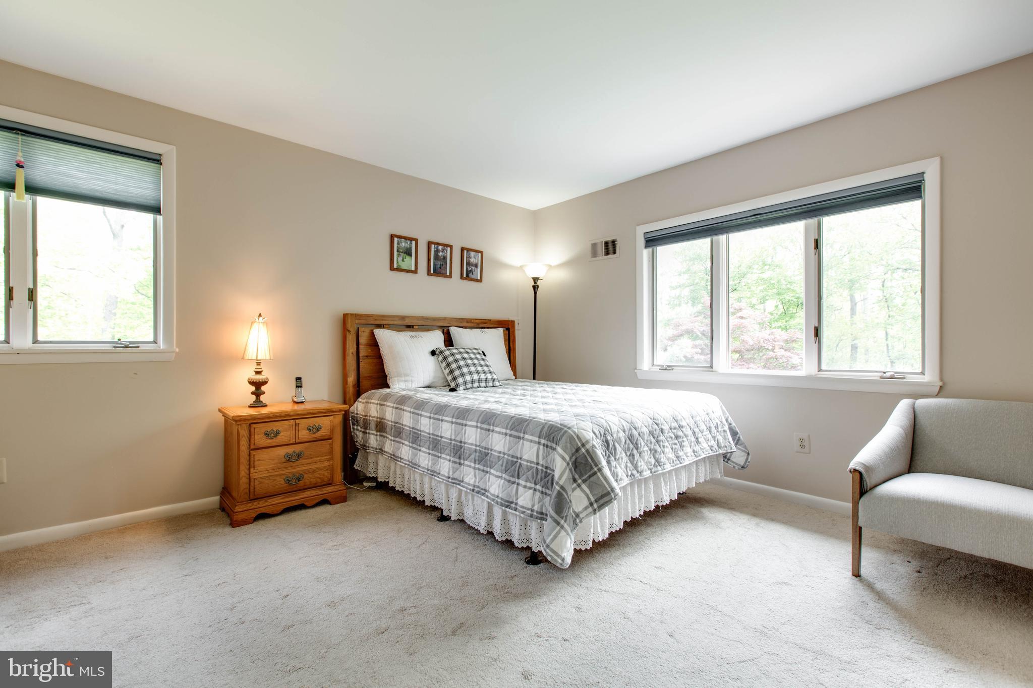 5519 Woodbine Road Sykesville, MD 21784 - Photo 24 of 69 a bedroom with a bed couch and window