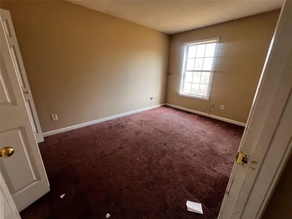 an empty room with windows