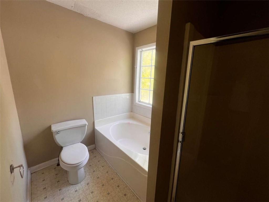 3648 Sapphire Court Decatur, GA 30034 - Photo 7 of 16 a white toilet sitting next to a bathroom sink
