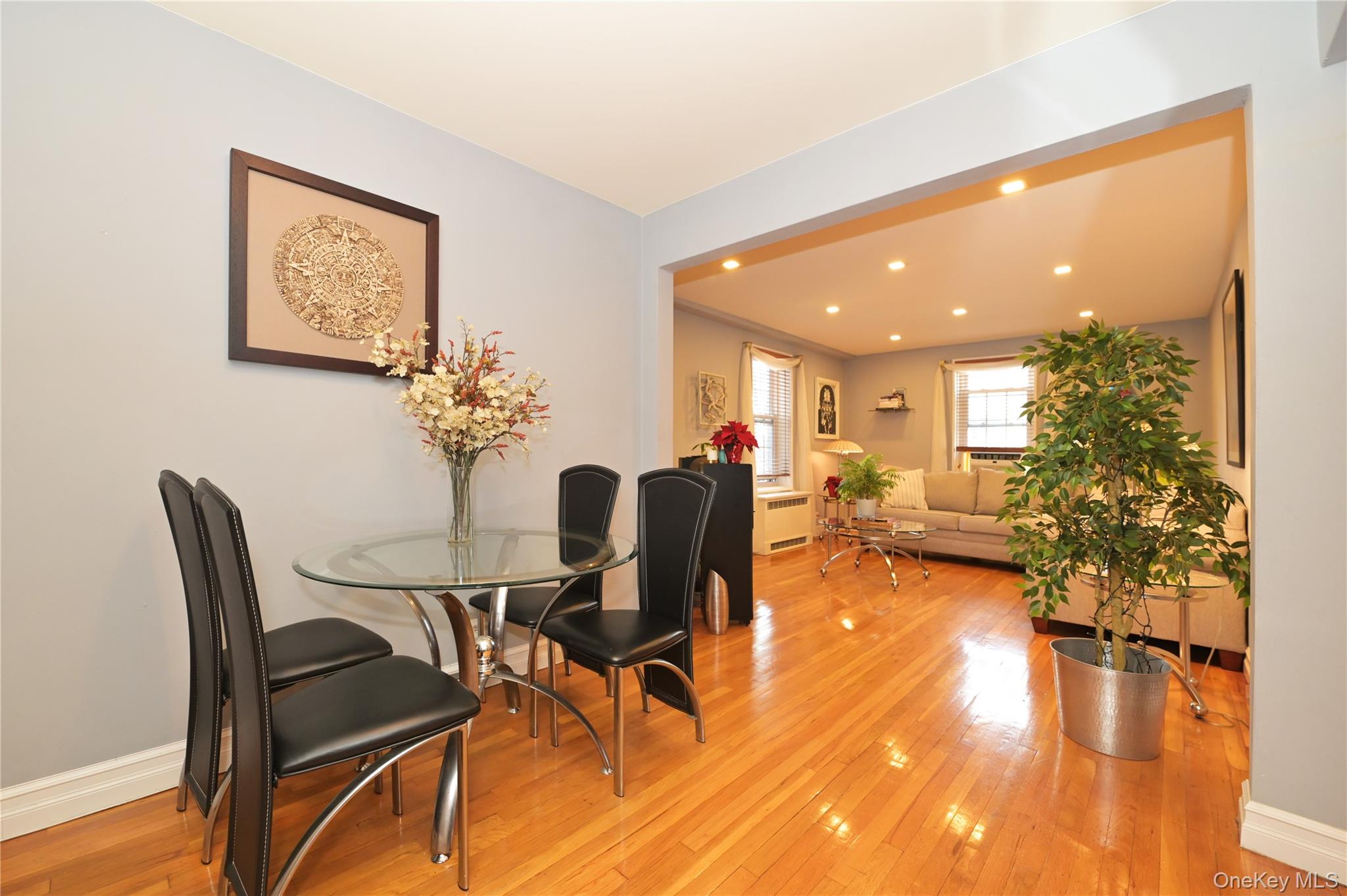139-09 84th Drive, Unit 306 Queens, NY 11435 - Photo 3 of 12 Dining space with light wood finished floors, recessed lighting, and radiator heating unit