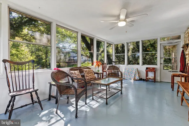 a dinning table and chairs in a room