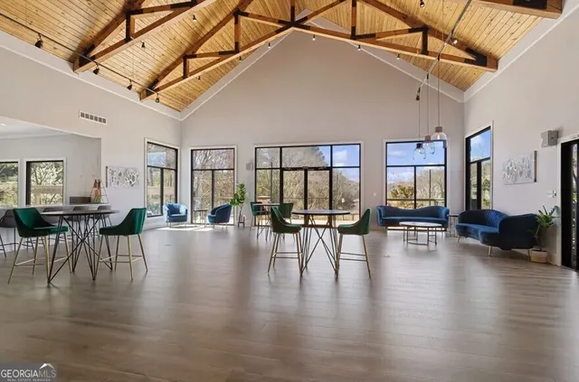 a view of a dining room with furniture window and wooden floor