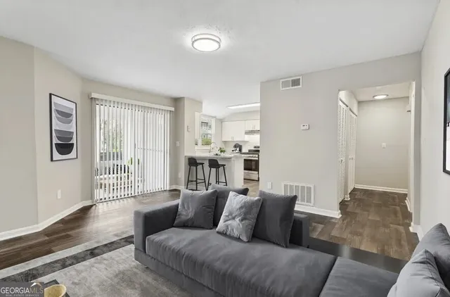 a living room with furniture and a table