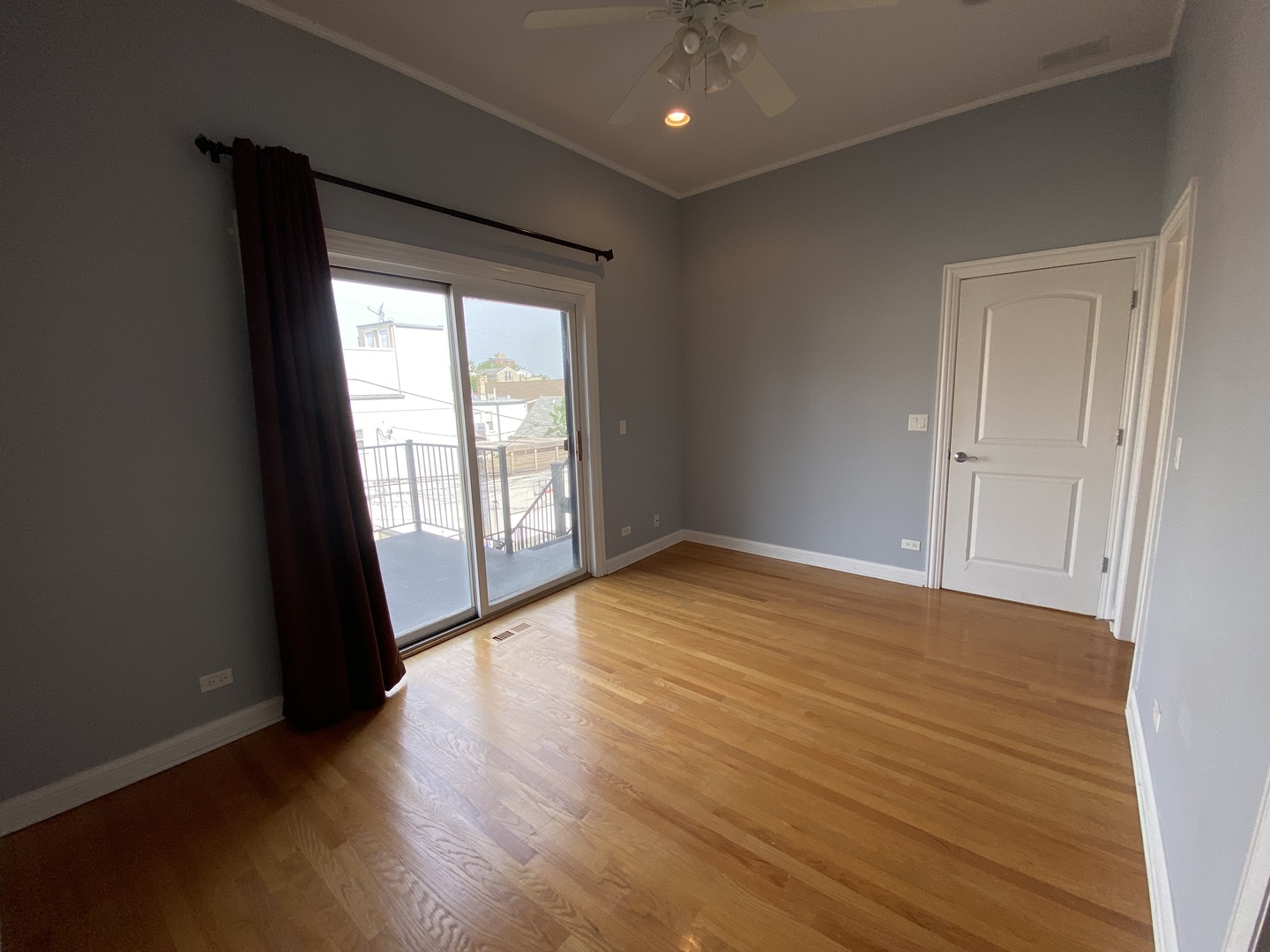 Undisclosed Address Chicago, IL 60613 - Photo 6 of 10 wooden floor in an empty room with a window