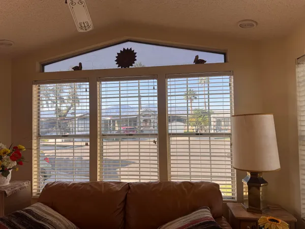 a bedroom with furniture and a window