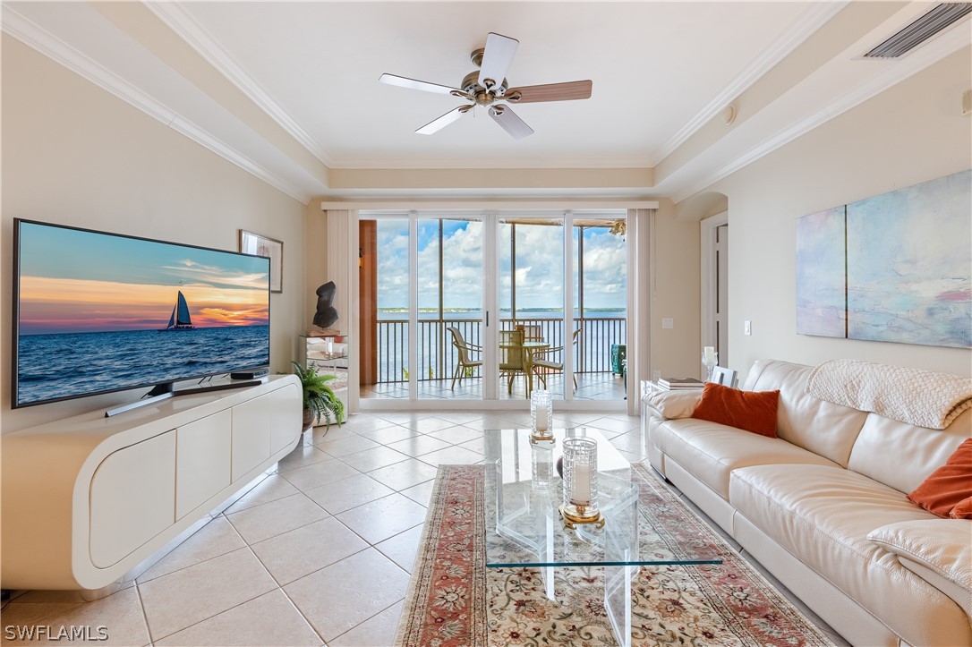 2743 First Street, Unit 602 Fort Myers, FL 33916 - Photo 11 of 38 a living room with furniture and a flat screen tv