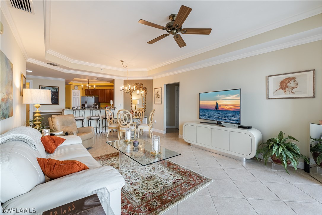 2743 First Street, Unit 602 Fort Myers, FL 33916 - Photo 12 of 38 a living room with furniture and a flat screen tv