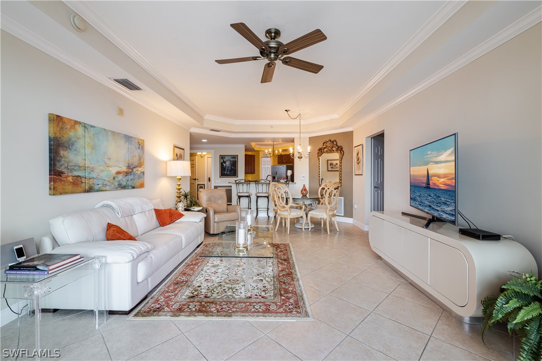 2743 First Street, Unit 602 Fort Myers, FL 33916 - Photo 13 of 38 a living room with furniture and a flat screen tv