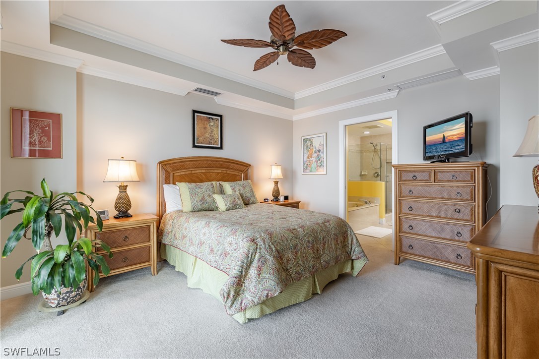 2743 First Street, Unit 602 Fort Myers, FL 33916 - Photo 14 of 38 a spacious bedroom with a bed and a tv