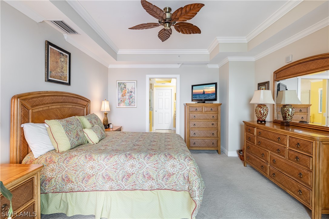 2743 First Street, Unit 602 Fort Myers, FL 33916 - Photo 15 of 38 a bedroom with a bed and a dresser