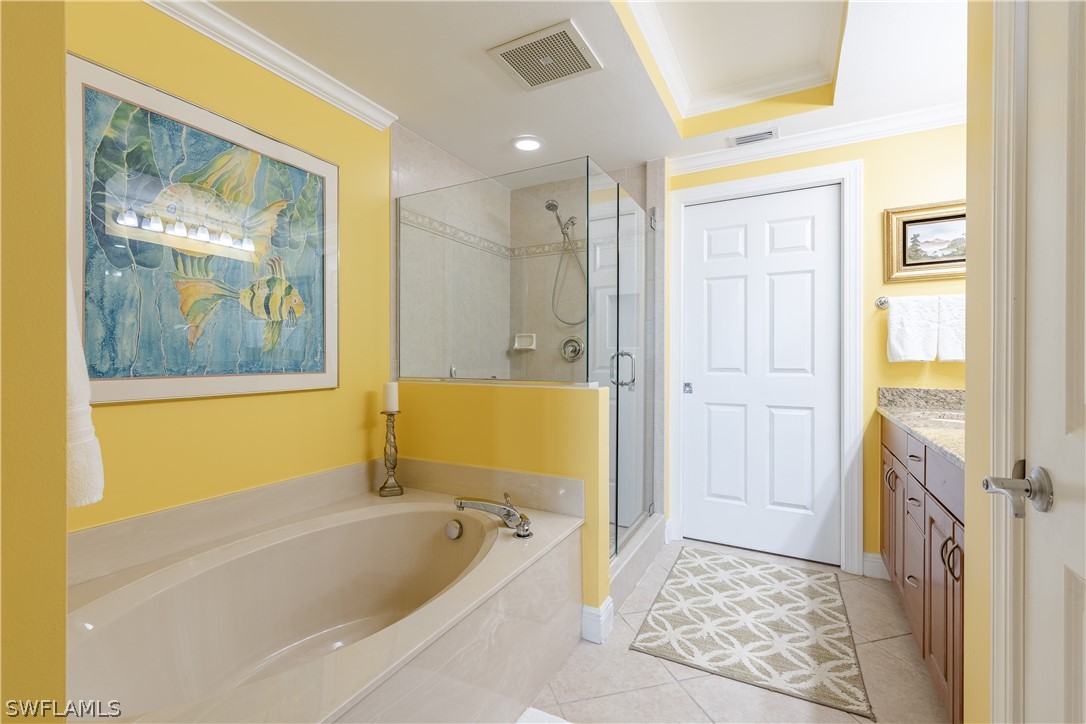 2743 First Street, Unit 602 Fort Myers, FL 33916 - Photo 17 of 38 a bathroom with a tub a sink and glass door