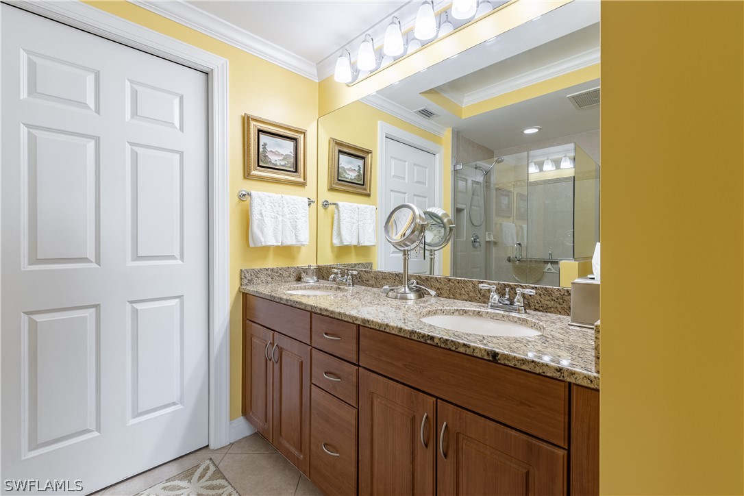 2743 First Street, Unit 602 Fort Myers, FL 33916 - Photo 18 of 38 a bathroom with a granite countertop sink and a mirror