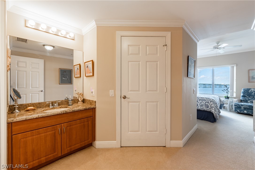 2743 First Street, Unit 602 Fort Myers, FL 33916 - Photo 21 of 38 a spacious bathroom with a double vanity sink and a mirror