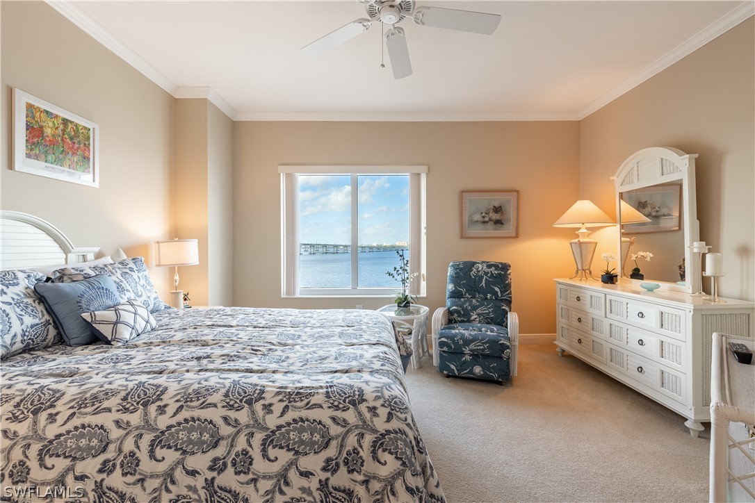 2743 First Street, Unit 602 Fort Myers, FL 33916 - Photo 22 of 38 a bedroom with a large bed and a dresser