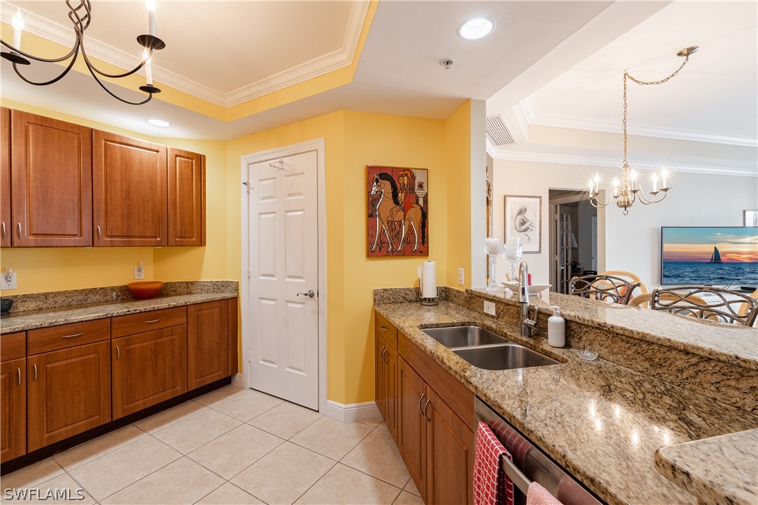 2743 First Street, Unit 602 Fort Myers, FL 33916 - Photo 5 of 38 a kitchen with stainless steel appliances granite countertop a sink and a refrigerator