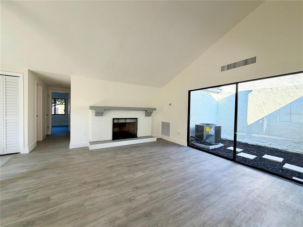 7314 Patio Row Hudson, FL 34667 - Photo 3 of 17 an empty room with floor to ceiling window