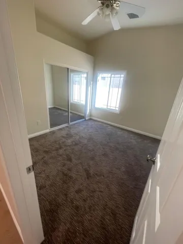 a view of a pathway both side of a house