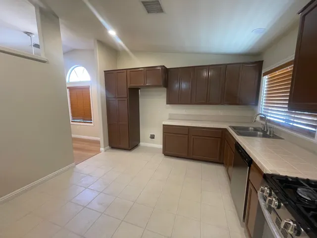 a view of an empty room with windows