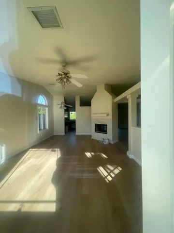 a view of a room with window and fireplace