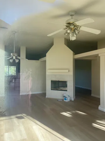 a view of hallway with wooden floor