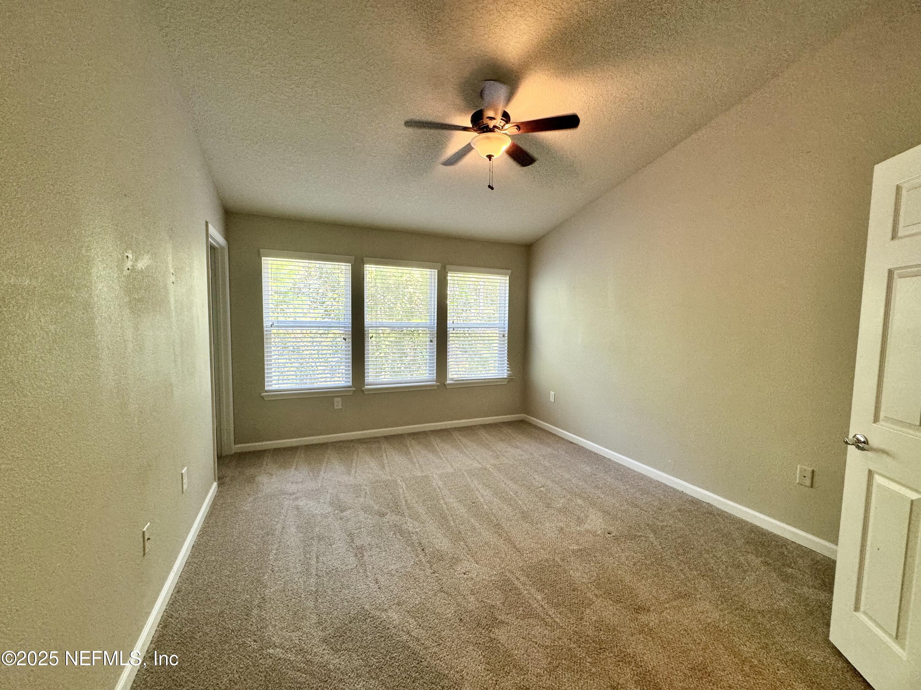 6839 Roundleaf Drive Jacksonville, FL 32258 - Photo 11 of 30 a view of an empty room with a window