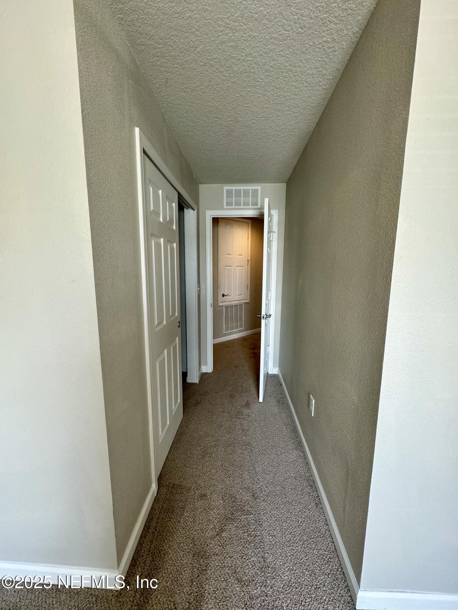 6839 Roundleaf Drive Jacksonville, FL 32258 - Photo 17 of 30 a view of hallway with furniture and stairs
