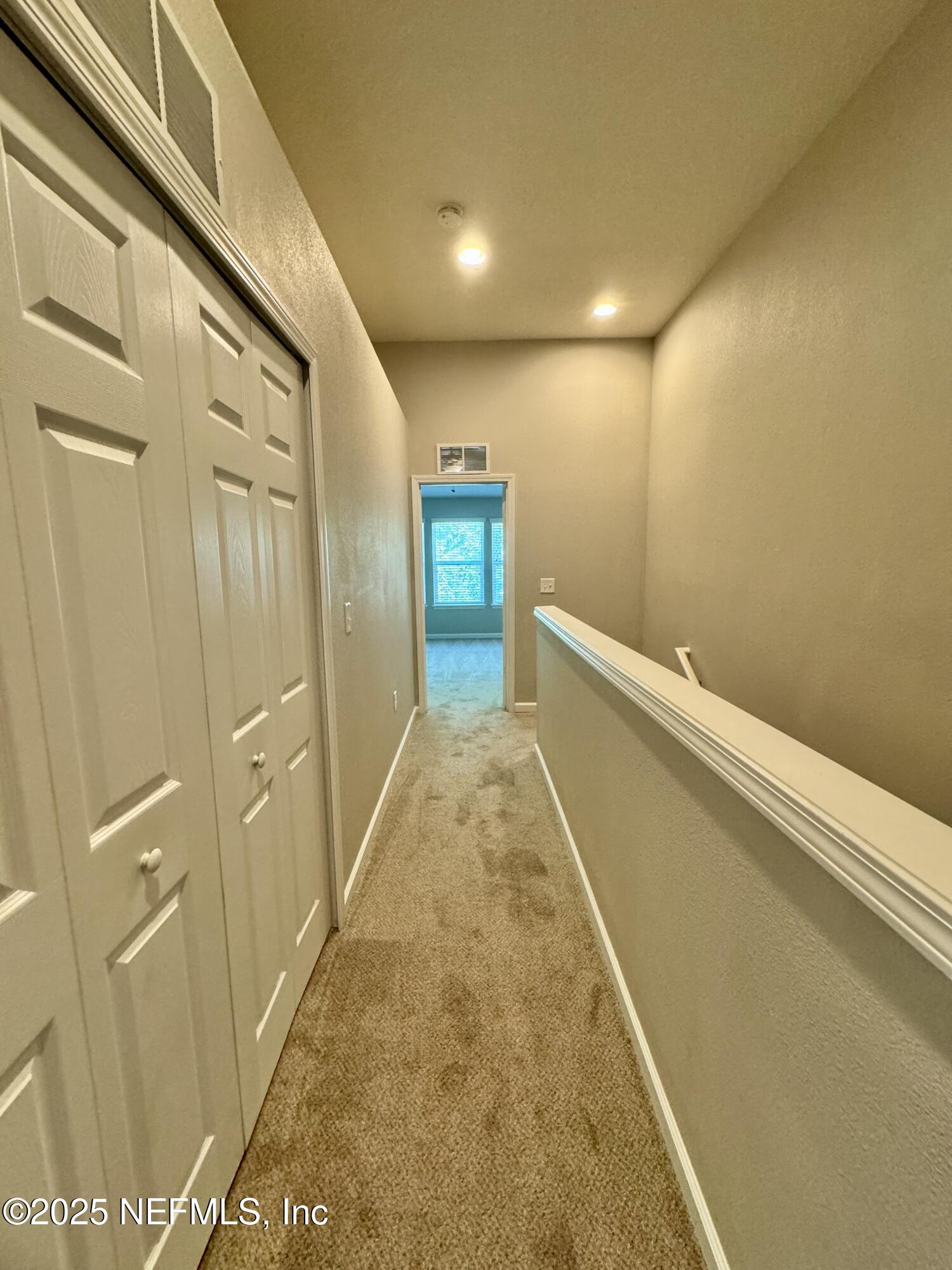 6839 Roundleaf Drive Jacksonville, FL 32258 - Photo 18 of 30 a view of a hallway with wooden floor