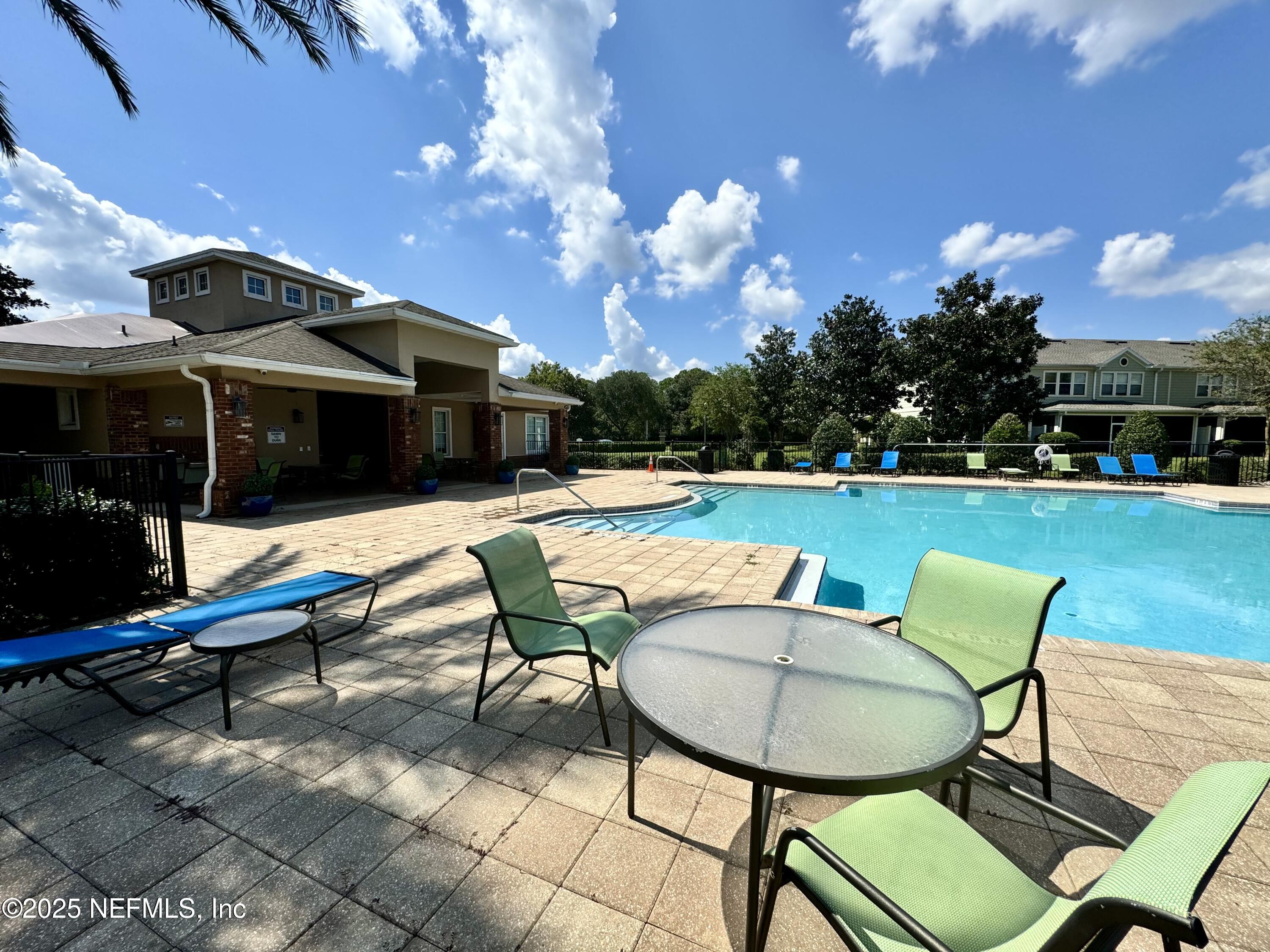 6839 Roundleaf Drive Jacksonville, FL 32258 - Photo 26 of 30 a view of a chairs and table in patio