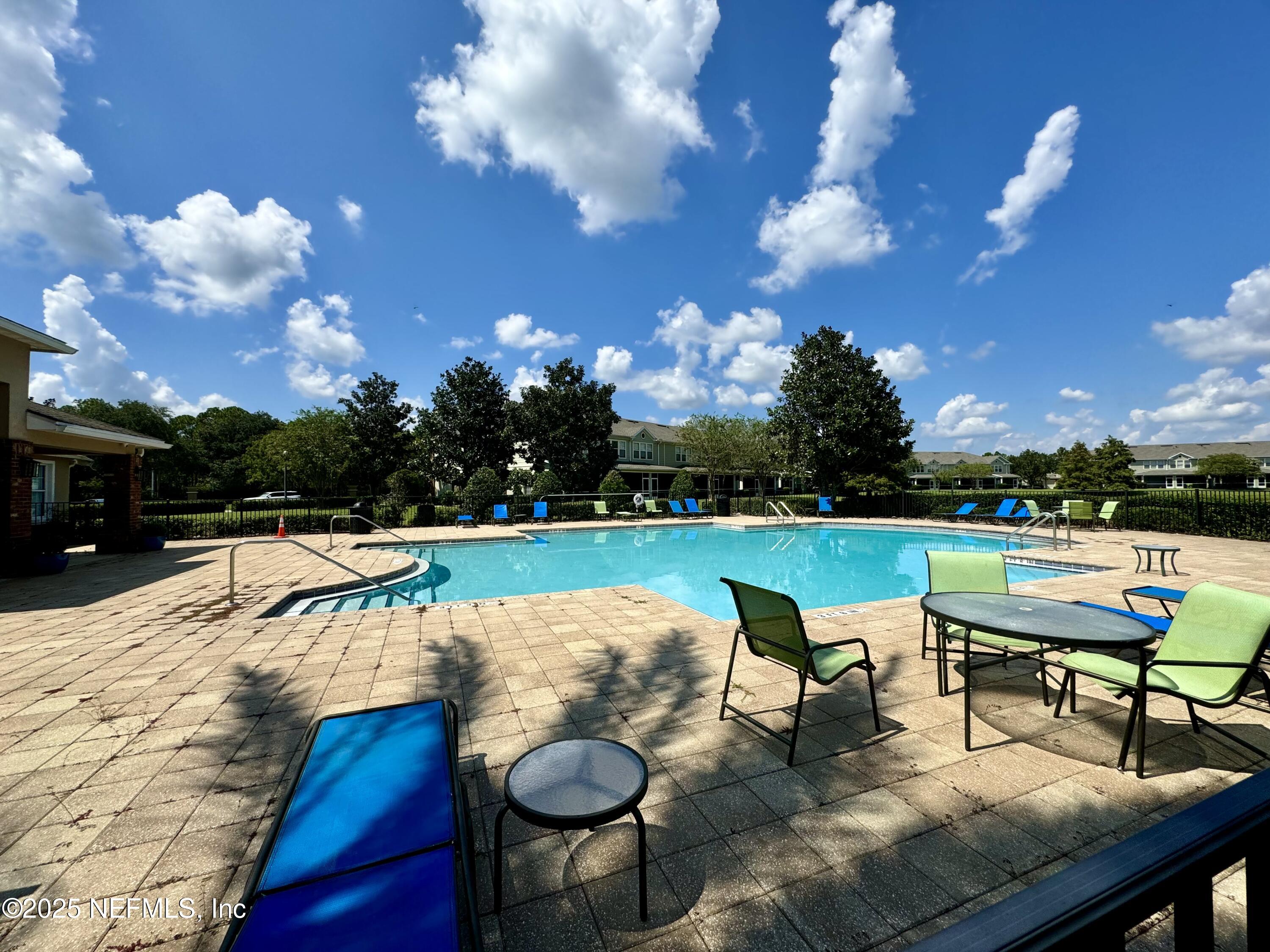 6839 Roundleaf Drive Jacksonville, FL 32258 - Photo 27 of 30 a view of a swimming pool with lounge chairs
