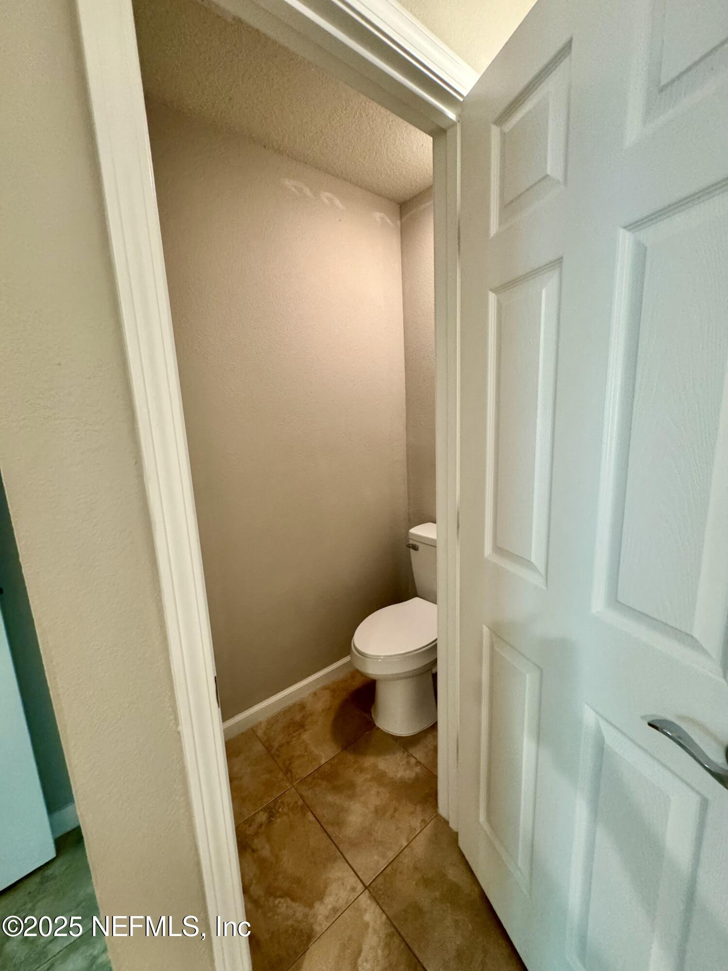 6839 Roundleaf Drive Jacksonville, FL 32258 - Photo 7 of 30 a bathroom with a toilet and a shower