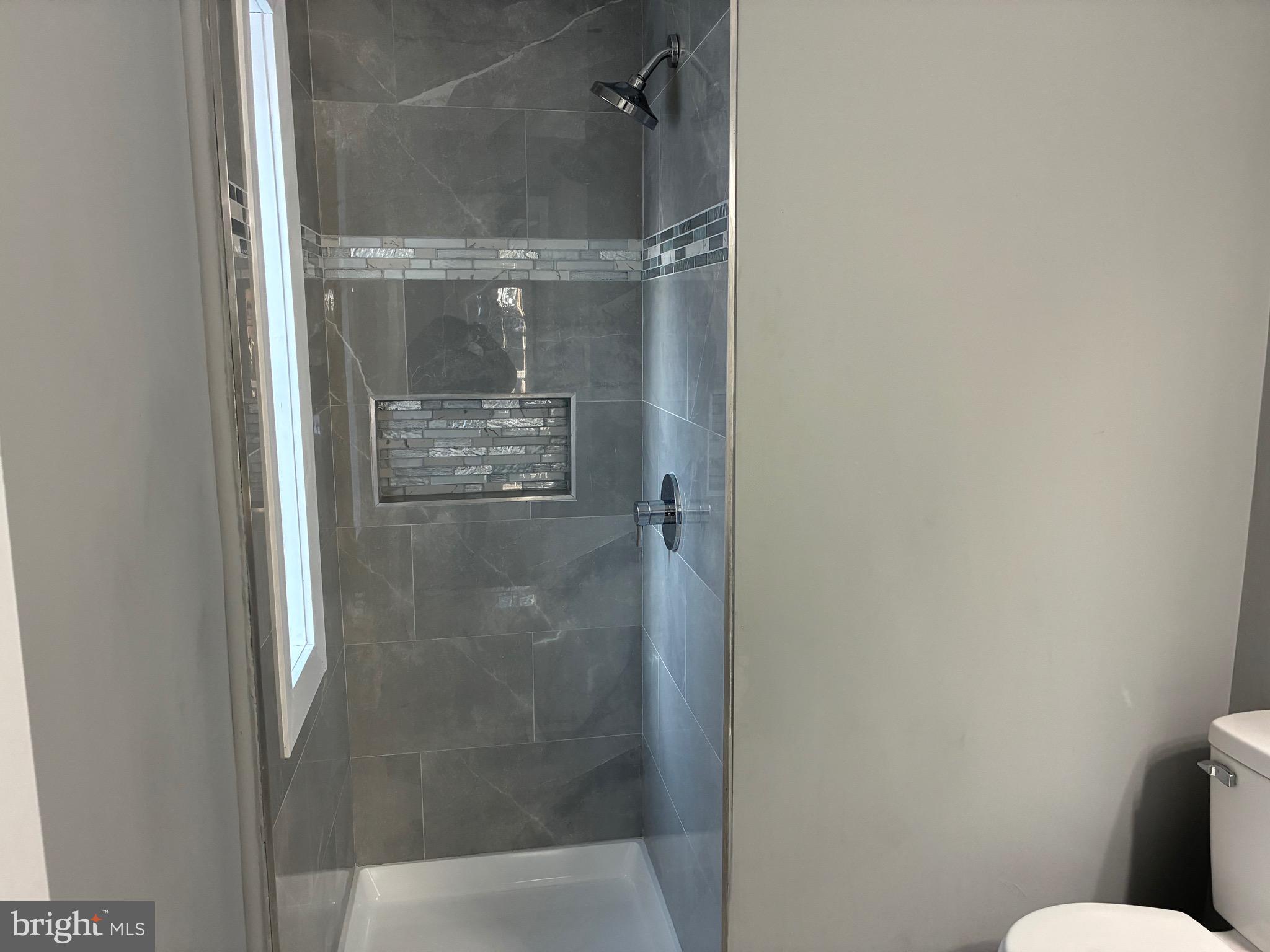 80 East 3rd Street Moorestown, NJ 08057 - Photo 19 of 37 a bathroom with a glass shower door