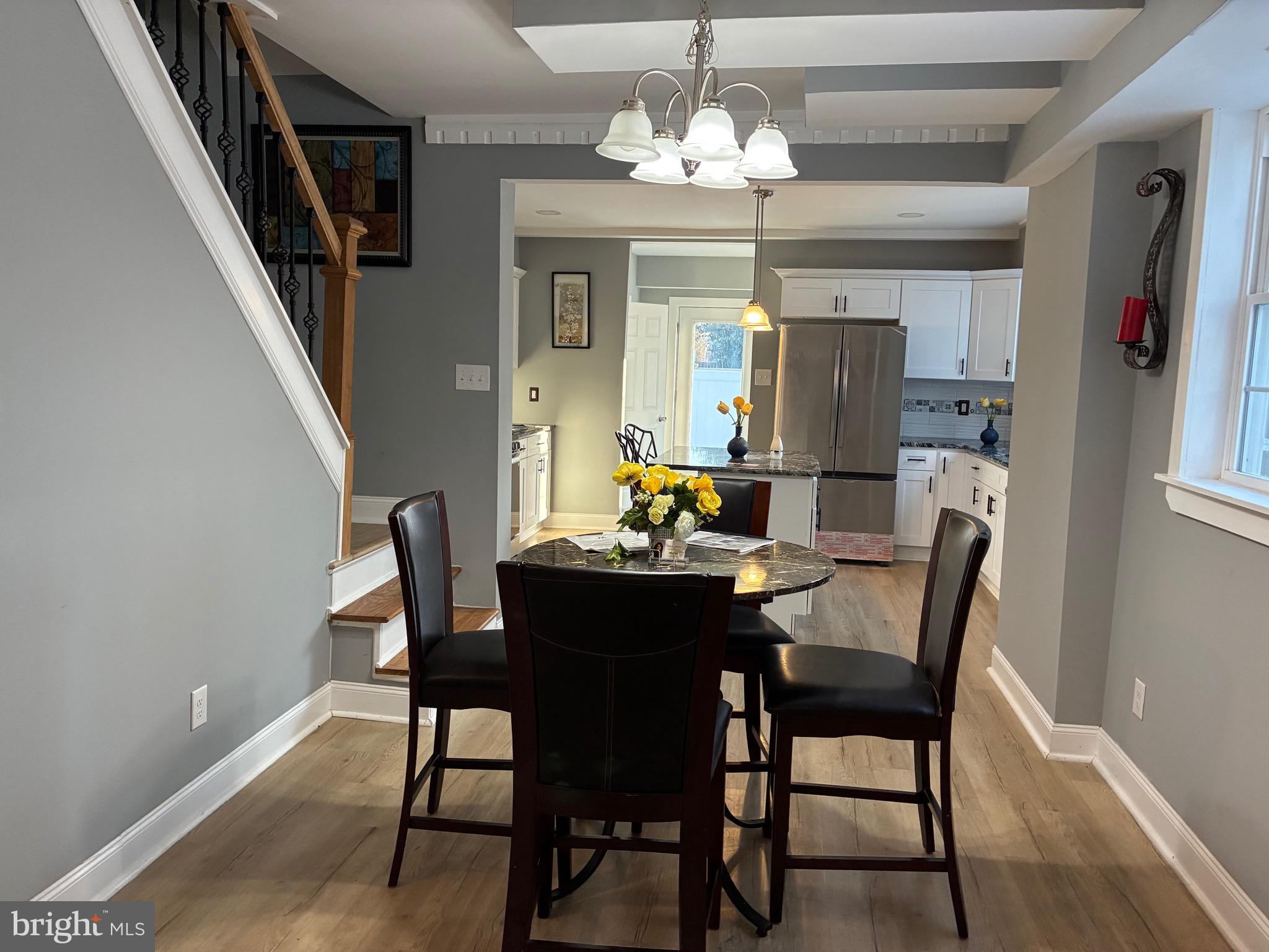 80 East 3rd Street Moorestown, NJ 08057 - Photo 3 of 37 a view of a dining room with furniture wooden floor and chandelier