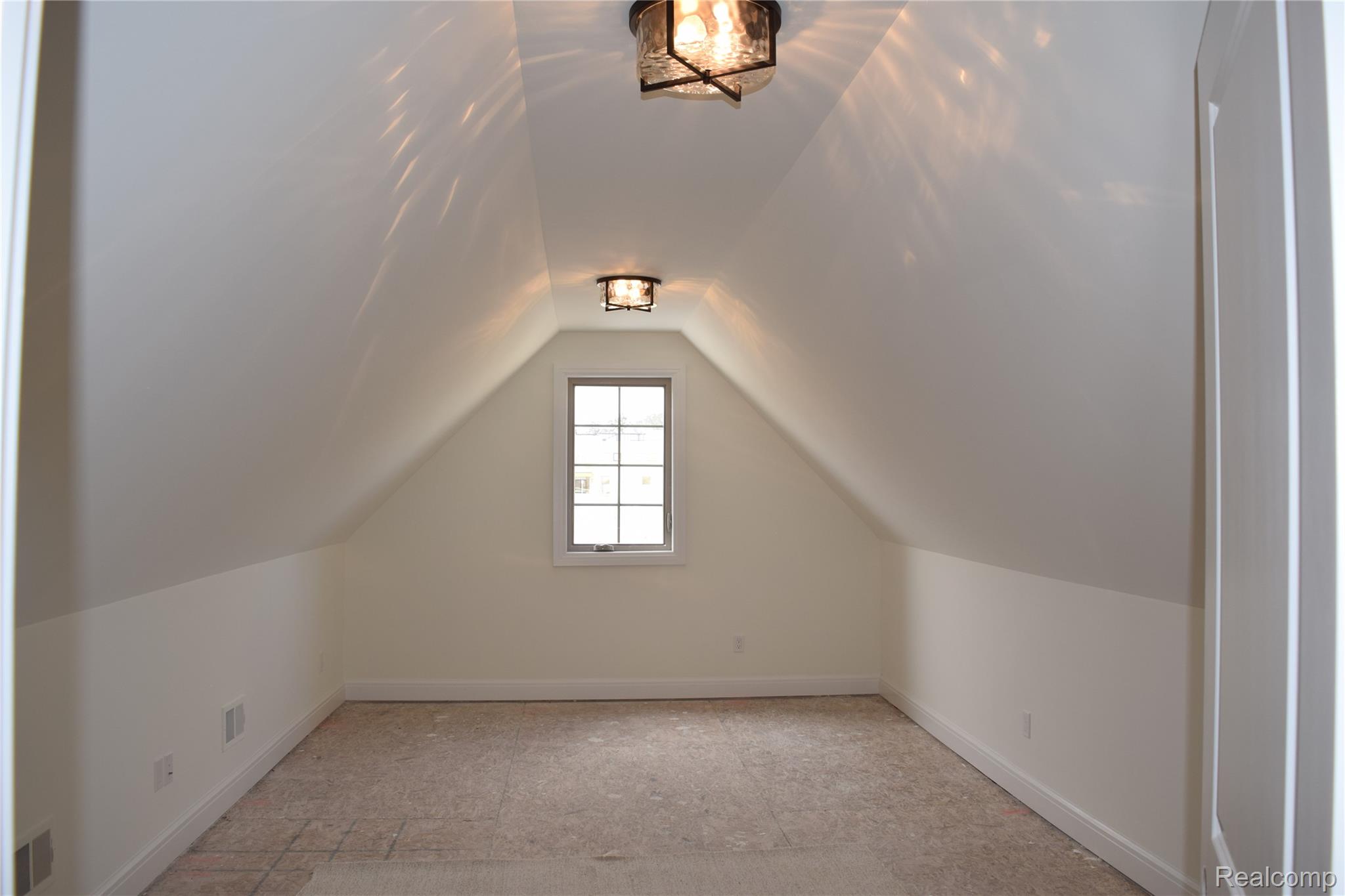 3093 Raffler Drive Rochester, MI 48307 - Photo 33 of 34 Bonus room with baseboards and vaulted ceiling