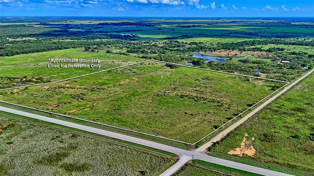 174 Windthorst Tx 76389 Henrietta, TX 76365 - Photo 15 of 18 a view of a yard with a wooden fence
