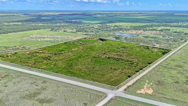 a view of a back yard from a balcony