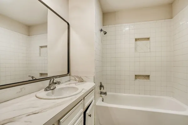 a bathroom with a sink and a bathtub