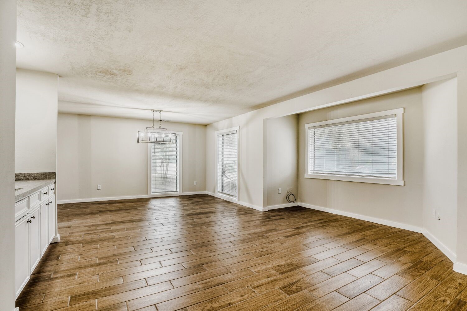 17804 Paddle Wheel Drive Spring, TX 77379 - Photo 2 of 17 a view of an empty room with window and wooden floor