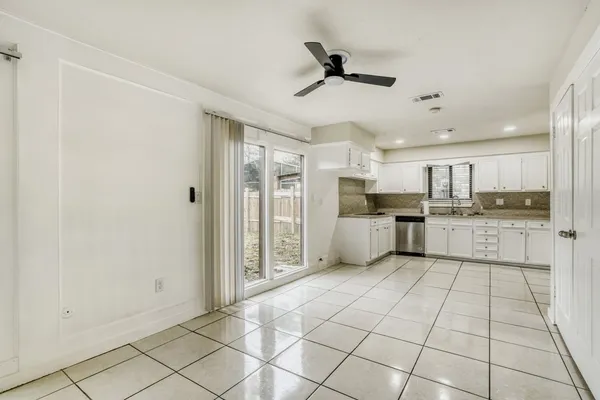 a view of a kitchen with electric appliances