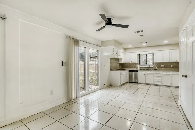 a view of a kitchen with electric appliances