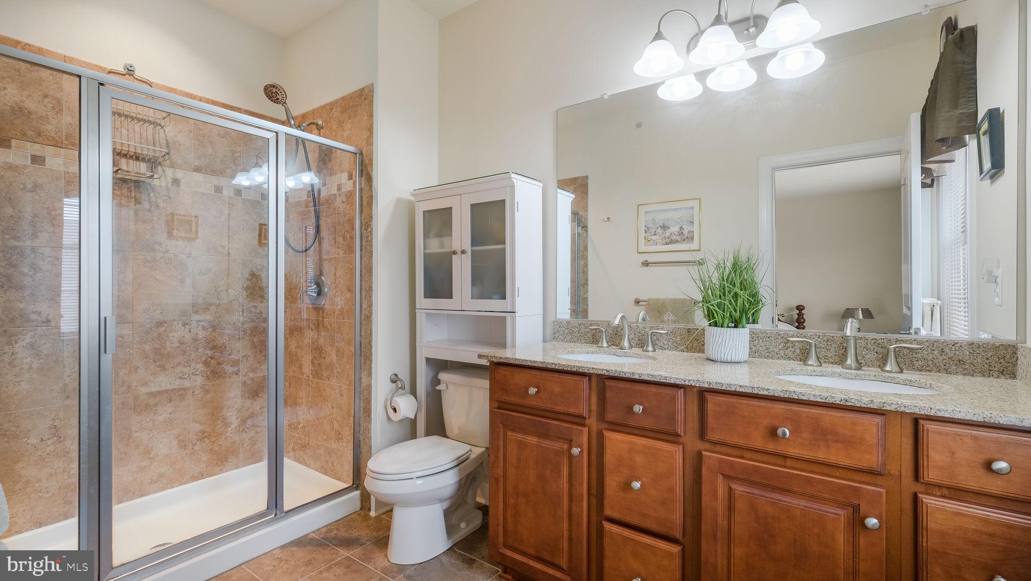 3699 William Daves Road Doylestown, PA 18902 - Photo 10 of 24 a bathroom with a granite countertop sink toilet and shower