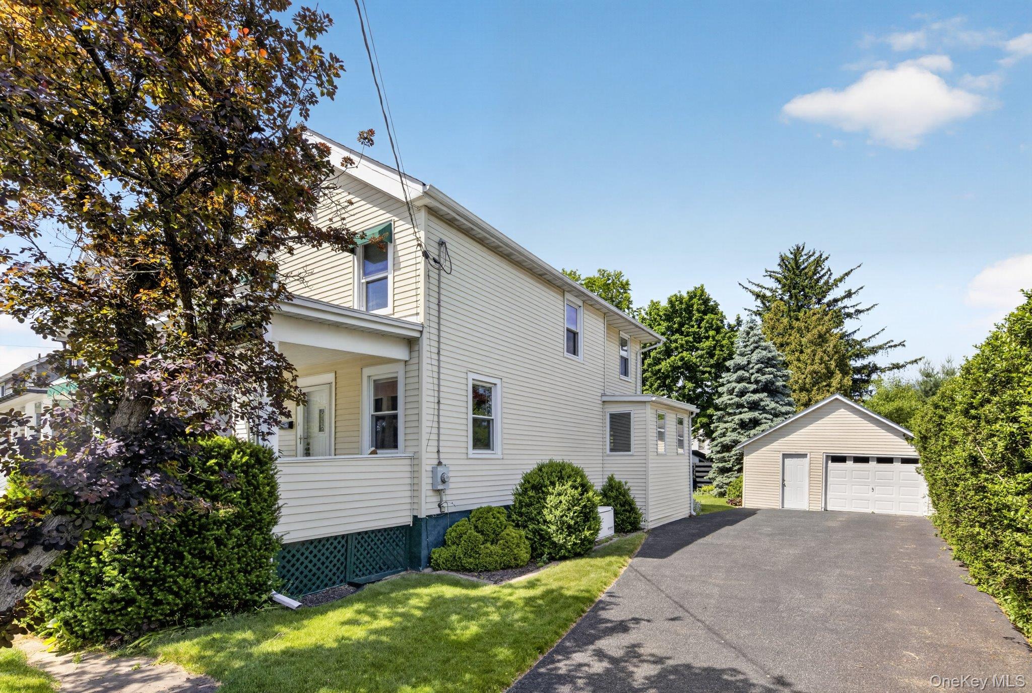250 Rombout Avenue Beacon, NY 12508 - Photo 2 of 33 a front view of a house with a garden