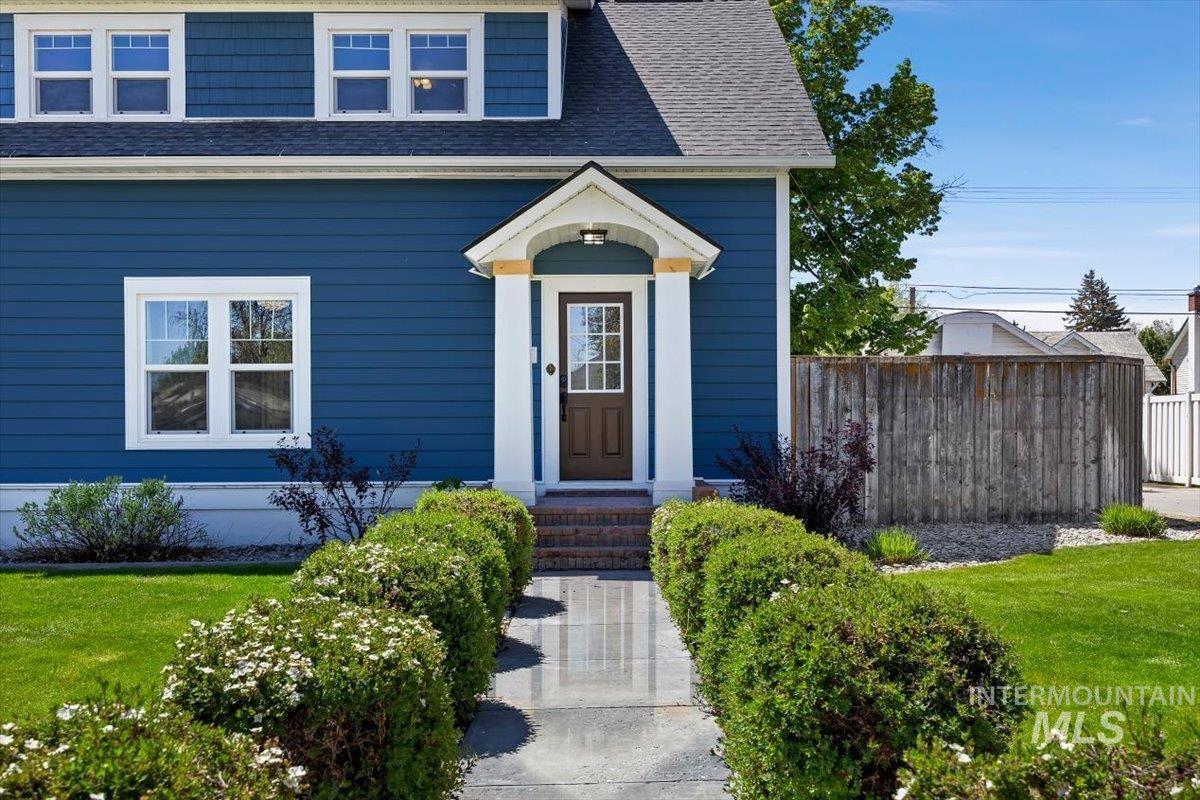 813 7th Street Rupert, ID 83350 - Photo 5 of 48 Blue siding exterior featuring white trim and a gabled roof
