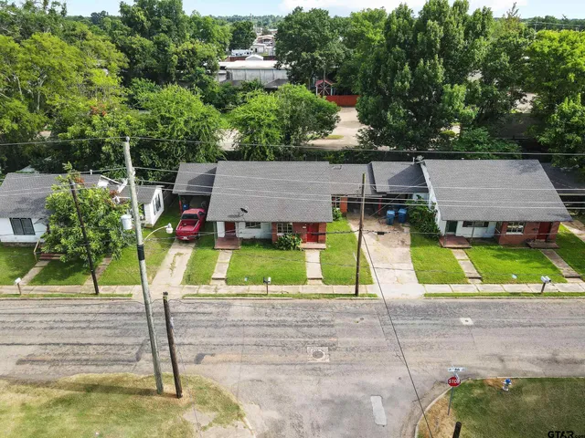 an aerial view of a house with swimming pool