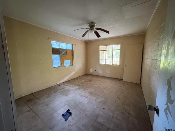 a view of walk in closet with empty tub