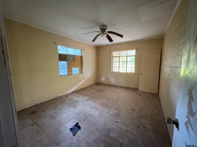 a view of walk in closet with empty tub